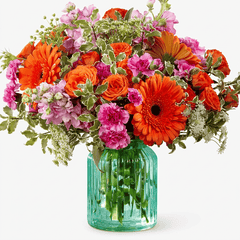 Orange and Pink Mixed Flowers in a Blue Vase