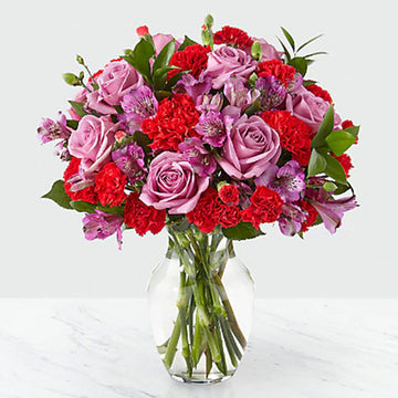 Assorted Purple and Red Vase Arrangement with Greens