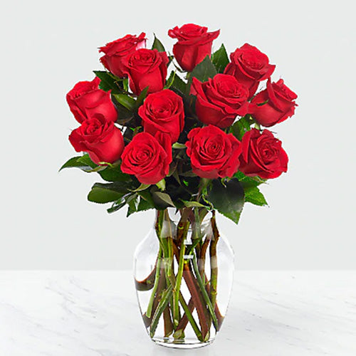 Dozen Red Roses in a Vase with Greens